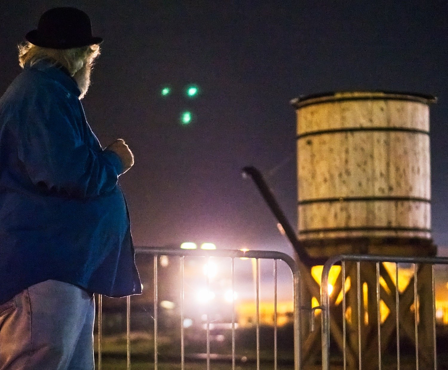 Jeff Hurley pauses his ghost story to look toward an approaching train.